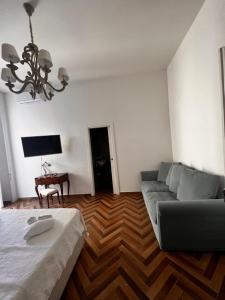 a living room with a couch and a table at Villa Valminuta in Ercolano