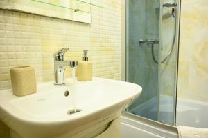 a bathroom with a sink and a shower at Space Apart Hotel in Lutsk +62 photos