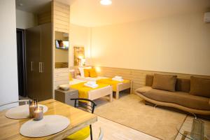 a living room with a couch and a table at Space Apart Hotel in Lutsk