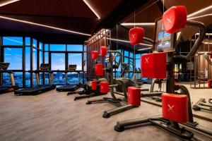 a gym with cardio equipment in a building at Downtown Chic Condo High Floor #E59 in Pattaya Central