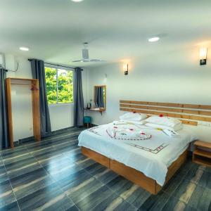 Postel nebo postele na pokoji v ubytování Ramzu Villa Thoddoo