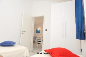 Postel nebo postele na pokoji v ubytování ONDINA apartments