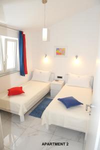 Postel nebo postele na pokoji v ubytování ONDINA apartments