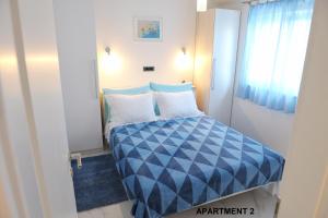 Postel nebo postele na pokoji v ubytování ONDINA apartments