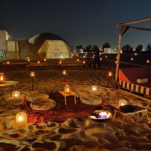 a night scene with lights and candles lit up at Pura Eco Retreat, Jubail Island in Abu Dhabi