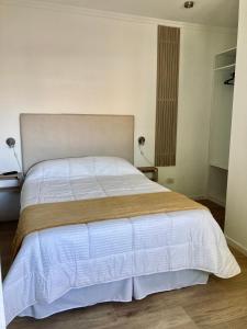 Ένα ή περισσότερα κρεβάτια σε δωμάτιο στο Departamentos Galarza Alojamiento en Concepción del Uruguay