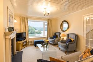 a living room with a couch and chairs and a television at Finest Retreats - Tideway in Saint Clement