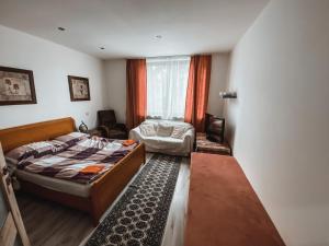 a small bedroom with a bed and a window at Cozy B&B Home in Banská Bystrica