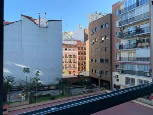 a view of a city street with tall buildings at Madrid Central, Apartamento Plaza de España in Madrid