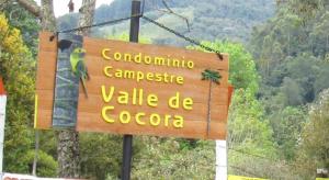 un signo que dice cambodia lieny value de coco en Casa Campo Valle De Cocora, en Salento