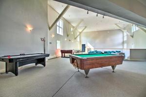 a large room with a pool table and a ping pong ball at Cozy Condo with Magic Mountain Ski-In Access! in Londonderry