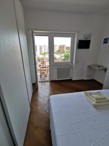 Posteľ alebo postele v izbe v ubytovaní Locazione Turistica Marinella Roma