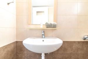 A bathroom at white house by the sea