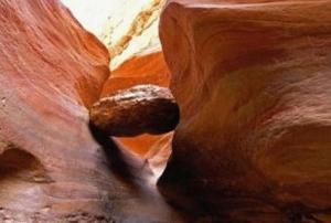 a rock in the middle of a slot canyon at Neptune Hotel in Dahab