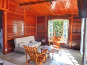 a living room with a couch and a table and chairs at CASA DA MATA - LAVRAS NOVAS in Lavras Novas