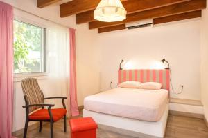 Postel nebo postele na pokoji v ubytování Villa Casa Azul & Arena Blanca Apartamentos