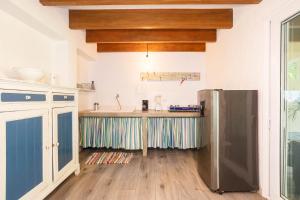 Kuchyň nebo kuchyňský kout v ubytování Villa Casa Azul & Arena Blanca Apartamentos