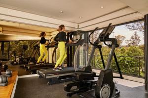 two women on treadmills in a gym at Campos Polanco in Mexico City