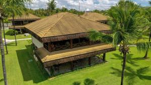 an overhead view of a building with a roof at Bangalô Eco Residence Flecheiras in Flecheiras