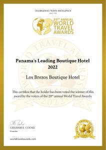 a poster for the world travel awards with a picture of a lion at Los Brezos Hotel Boutique in Volcán