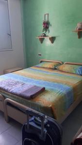 Tempat tidur dalam kamar di Bella casa da Paola