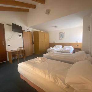 Voodi või voodid majutusasutuse Hotel Olisamir toas