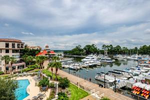 a marina with boats docked in a harbor at Yacht Club Villas 7542 in Hilton Head Island