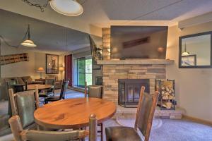 a dining room with a table and a fireplace at Beaver Run Resort in Breckenridge