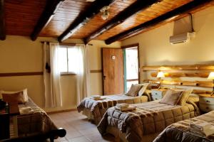 Una cama o camas en una habitación de Portal de La Cumbre 37 fotos más