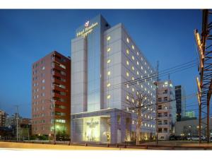 a tall building with a sign on the side of it at Hotel Ronshan Sapporo - Vacation STAY 64963v in Sapporo