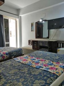 Postel nebo postele na pokoji v ubytování Windsor Hotel Luxor