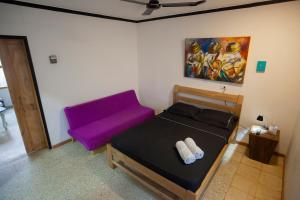 Postel nebo postele na pokoji v ubytování Hostal El Bando