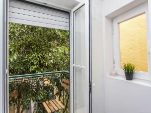 an open door to a balcony with a bench at Convento Apartment Rossio in Lisbon