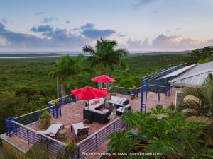 an aerial view of a resort with chairs and umbrellas at Casa de Colores, Vieques in Vieques