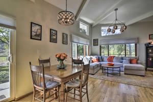 a living room with a table and a couch at Waterfront Troutdale Hideaway Sandy River Fishing in Troutdale