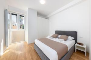 Posteľ alebo postele v izbe v ubytovaní Casa da Suite Centrale