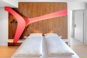 Ein Bett oder Betten in einem Zimmer der Unterkunft Prize by Radisson, Vienna City