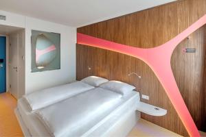 Ein Bett oder Betten in einem Zimmer der Unterkunft Prize by Radisson, Vienna City