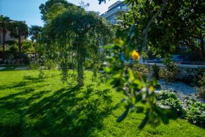 A garden outside Ca' delle Contesse - Villa on lagoon with private dock and spectacular view