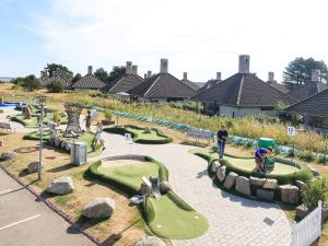 un parque infantil con campos de minigolf en 6 person holiday home on a holiday park in Karreb ksminde, en Karrebæksminde