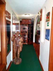 a statue of a man standing in a room at Mirador de Bellavista Riobamba in Riobamba