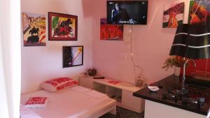 a room with a bed and a desk and a tv at Apartments with a parking space Mali Iz (Iz) - 15278 in Veli Iž