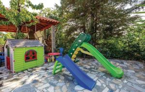 a playground with a slide and a play house at Apartments with a parking space Kastav, Opatija - 15287 in Kastav