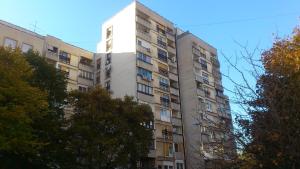 a tall apartment building with a white tower at Apartments with WiFi Zagreb - 15314 in Zagreb