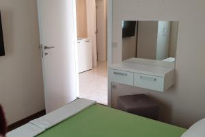 a room with a bed and a mirror at Double Room Hvar 15378a in Hvar