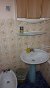 a bathroom with a sink and a toilet at Double Room Hvar 15378a in Hvar