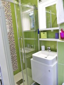 a bathroom with a sink and a shower at Apartments with WiFi Zagreb - 15474 in Zagreb