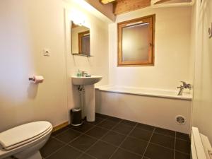 a bathroom with a toilet and a sink and a tub at Chalet pour 8 pers. 4 chambres, 3 SDB à Chamrousse - FR-1-549-107 in Chamrousse +10 photos