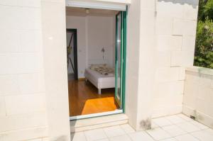 Postel nebo postele na pokoji v ubytování Seaside holiday house Zaostrog, Makarska - 15623