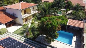 an aerial view of a house with solar panels at Pousada Villa Manduca in Amontada